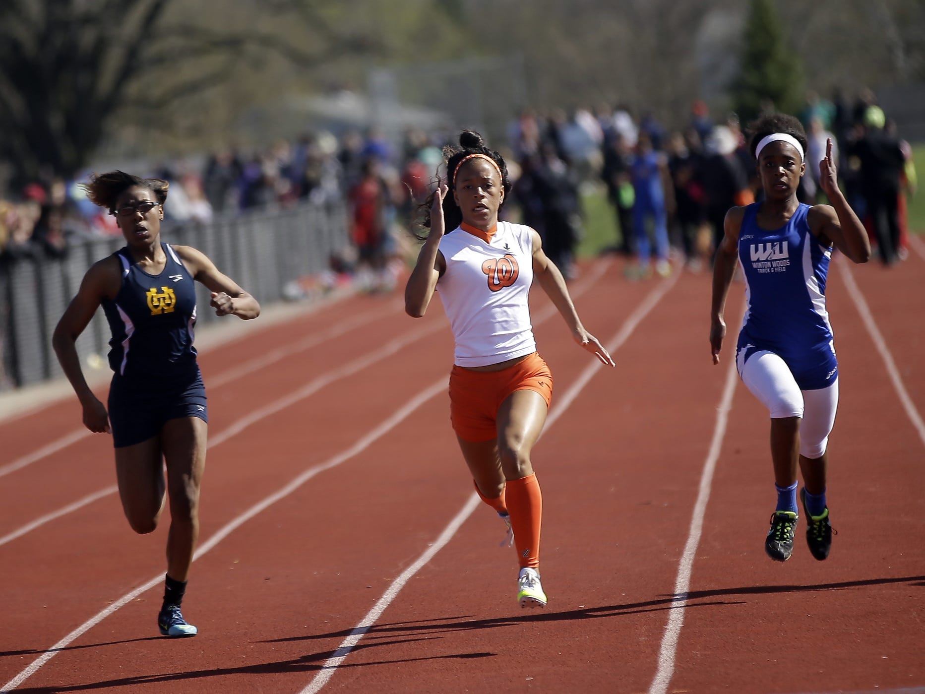 Withrow’s Destiny Pennington, (center) wins the girls 100 meters beating out Walnut Hills Arissa Freeman of Walnut Hills and Brianna Richard of Winton Woods at the Coaches Classic April 10.