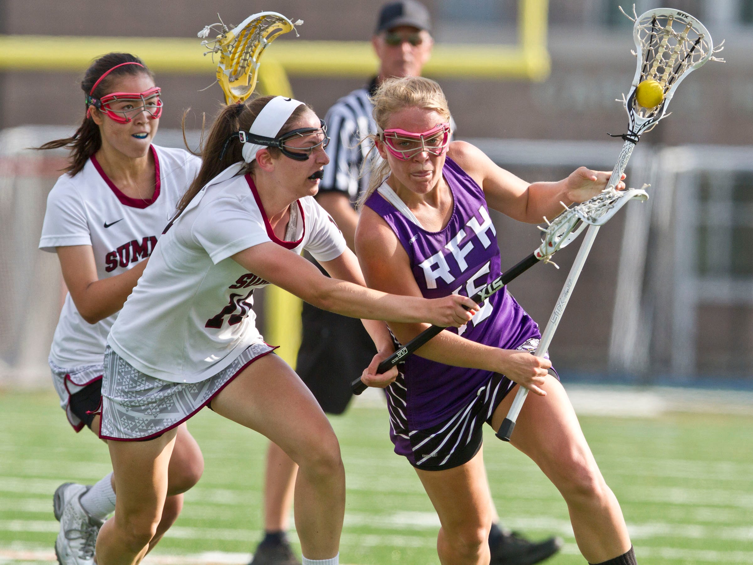 Rumson-Fair Haven's Maggie Jennings (16) drives through Summits Julia Persche and Teia Ross. NJSIAA Group II state final between Rumson-Fair Haven and Summit. Union Township, NJ Saturday, May 30, 2015 Doug Hood/Staff Photographer @dhoodhood
