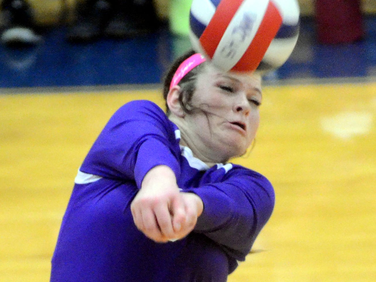 Portland High senior Abby Akins passes a serve during the third game.