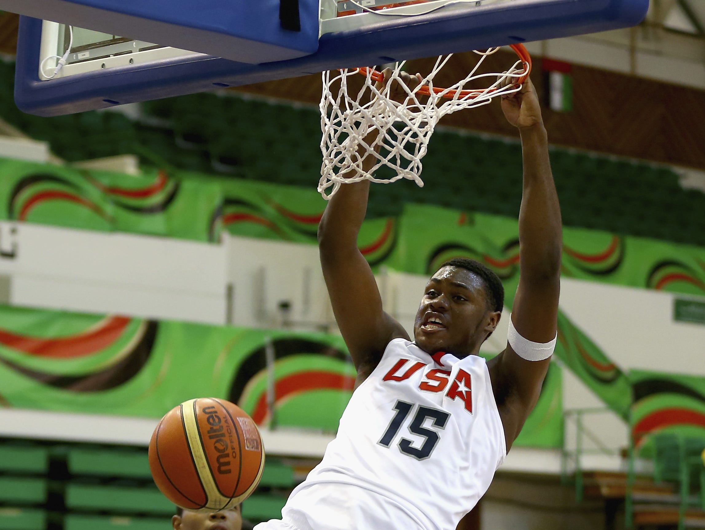 Diamond Stone of the United States shoots against Daniel Nnanna of Japan during the FIBA U17 World Championships Group Match between Japan and United States of America at Al Shabab Club on August 12, 2014 in Dubai, United Arab Emirates.