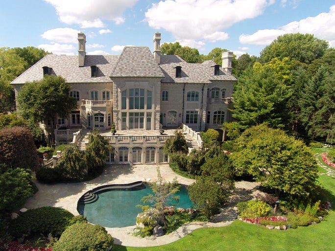 Aerial of the rear of the Art Van Elslander estate. To register to bid in the "absolute auction," a $200,000 certified check payable to the escrow agent, wire transfer or a personal check along with bank letter of guarantee is required, according to the brochure listing the sale.