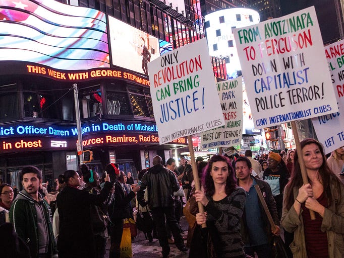 NEW YORK, NY - NOVEMBER 24:  Protesters march through