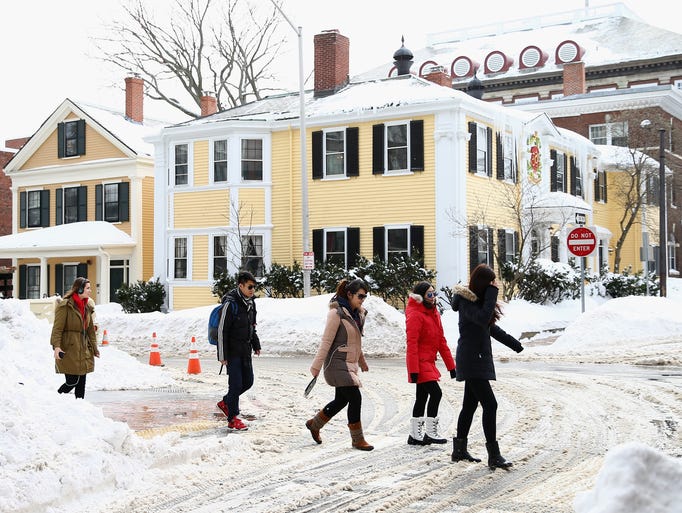 BOSTON, MA - FEBRUARY 10: Pedestrians navigate snow