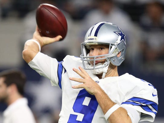 Dallas Cowboys quarterback Tony Romo (9) warms up before