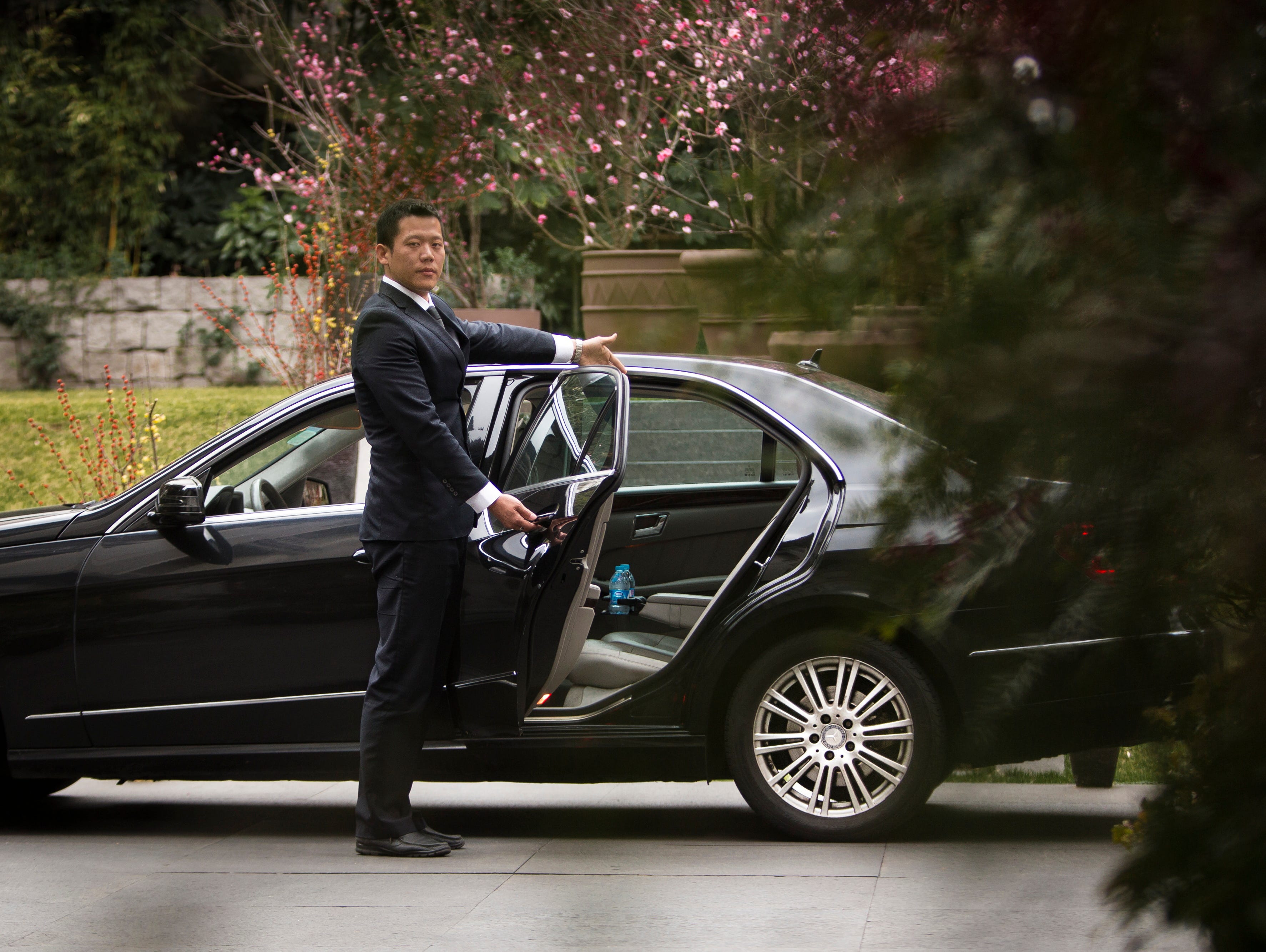 A photo illustration showing an Uber driver awaiting a rider