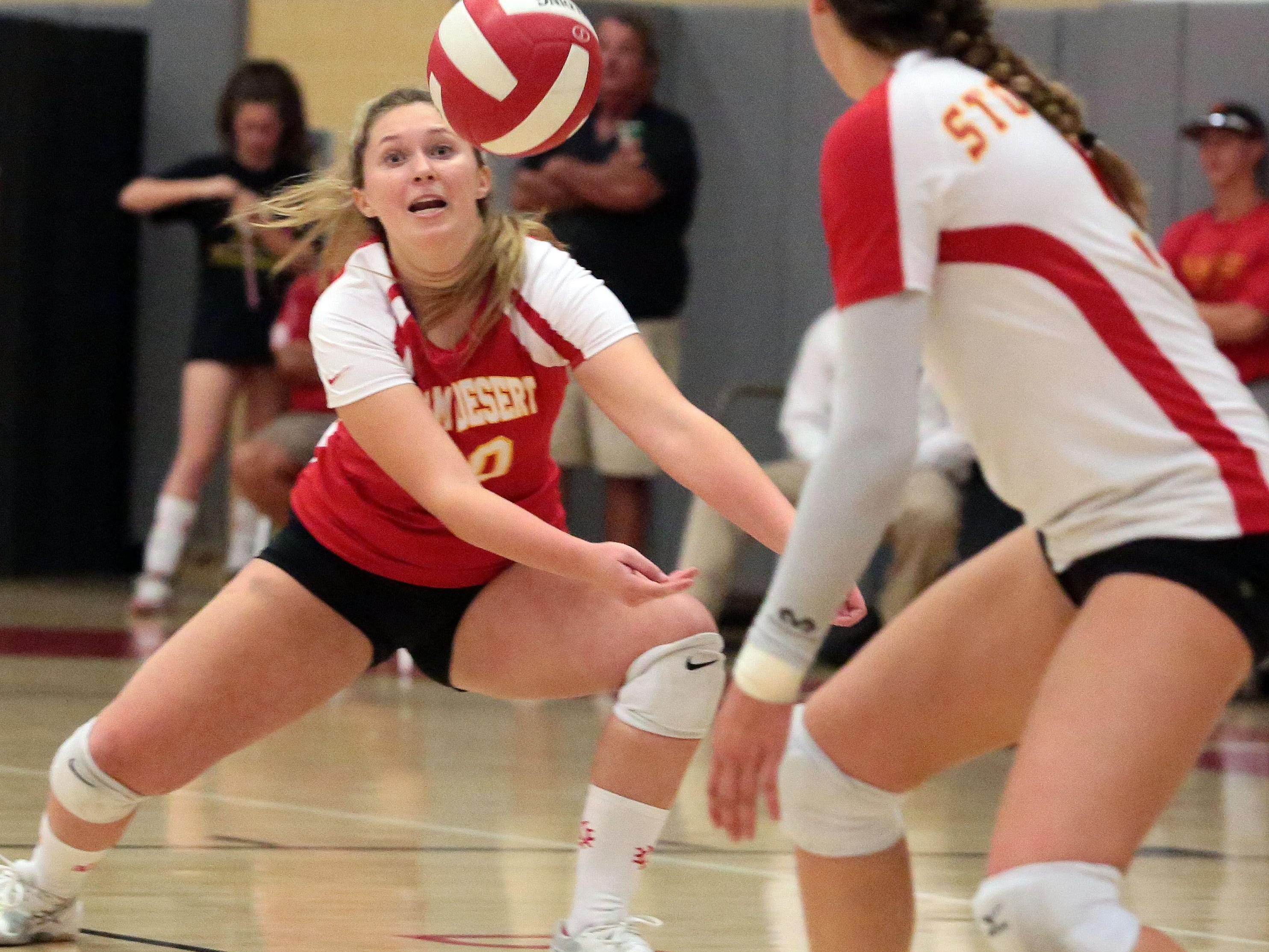 Palm Desert Kacey Johnson digs against Palm Springs on Thursday in Palm Desert.