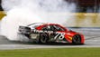 Martin Truex Jr. does a victory burnout after leading