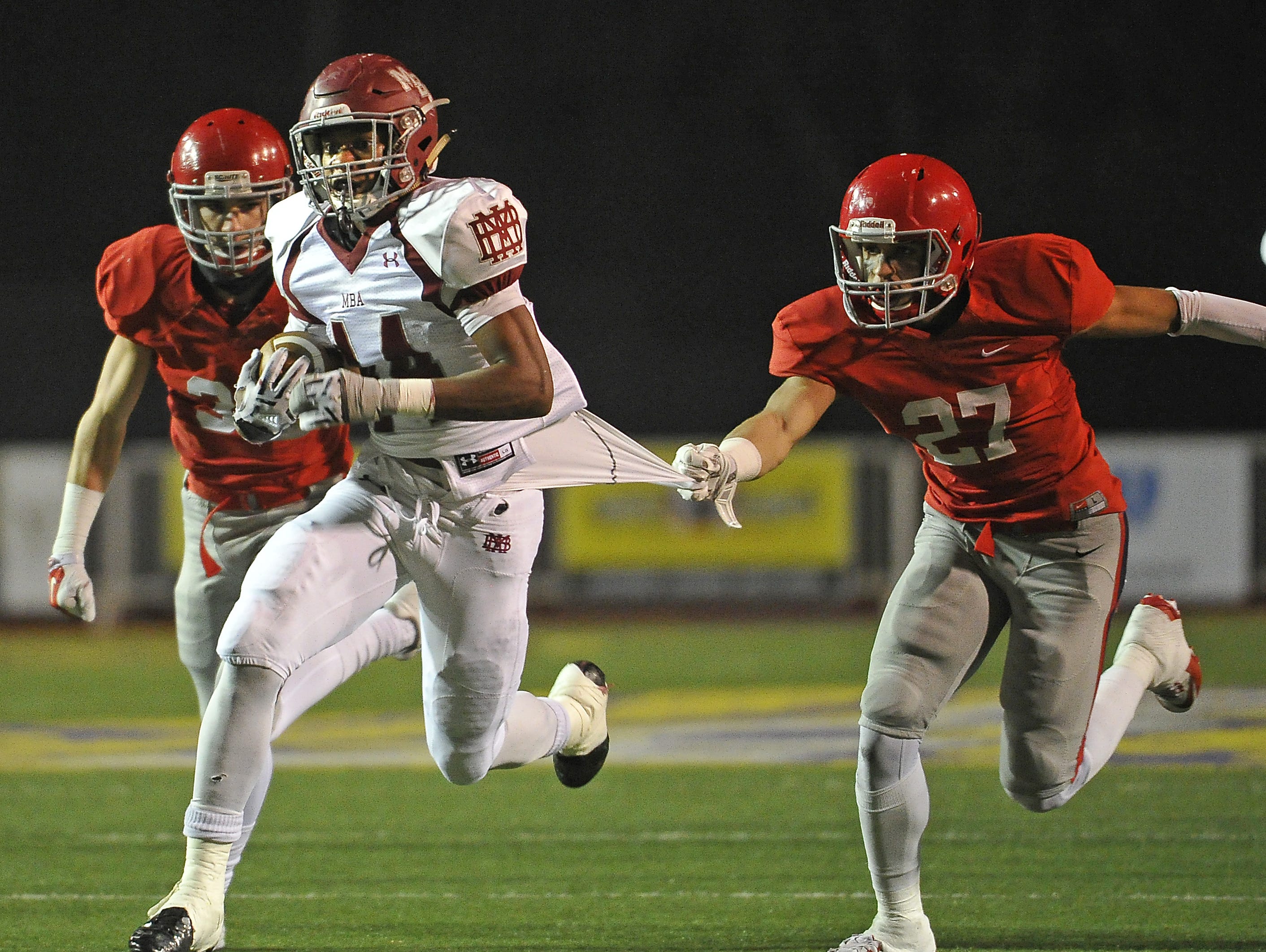 MBA's Ty Chandler breaks free of Brentwood Academy's Cam Johnson during the BlueCross Bowl.