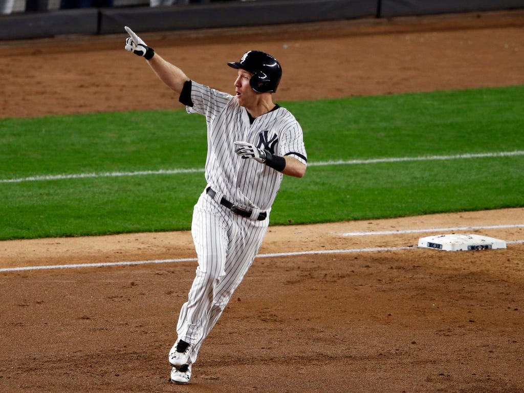 New York Yankees third baseman Todd Frazier hits a three run home run during the second inning against the Houston Astros during game three of the 2017 ALCS playoff baseball series at Yankee Stadium in New York.