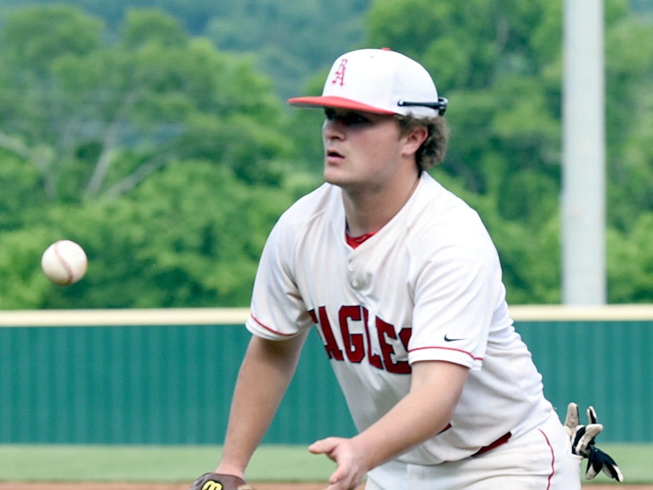 Brentwood Academy first baseman Easton Cline flips to starting pitcher Jack Victory for a third-inning putout.