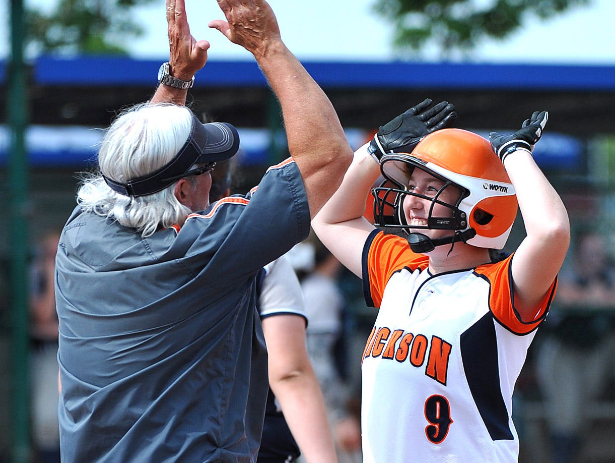 Coach Bert Newberry congratulates Paige Sensing after an RBI single in the Class AAA championship game on May 27, 2016.