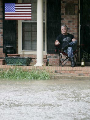 Donald Fontaine sits on his Rebel Circle front porch