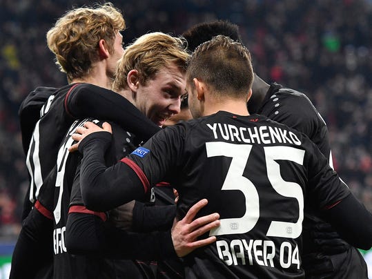 Leverkusen's scorer Julian Brandt, front left, and his teammates celebrate their side's 2nd goal during the Champions League, group E, soccer match between Bayer 04 Leverkusen and AS Monaco in Leverkusen, Germany, Wednesday, Dec. 7, 2016. (AP Photo/Martin Meissner)