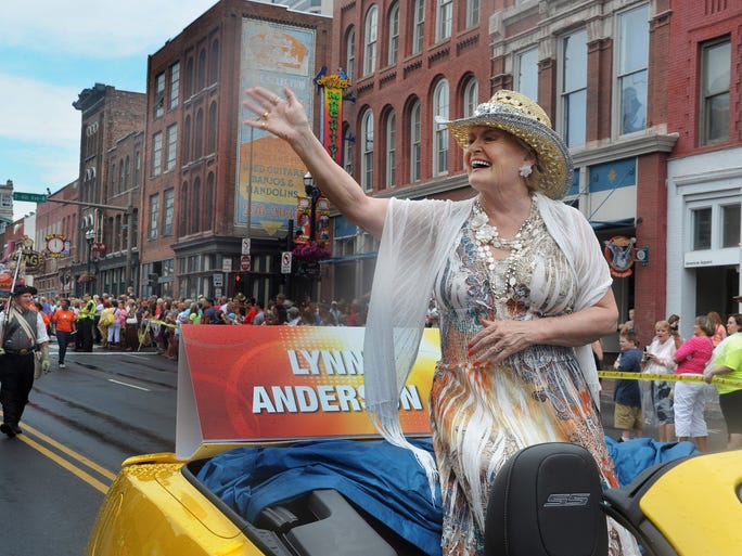 Country star Lynn Anderson waves to the crowd during the CMA Music Festival Kick-Off Parade on June 5, 2013, in downtown Nashville.