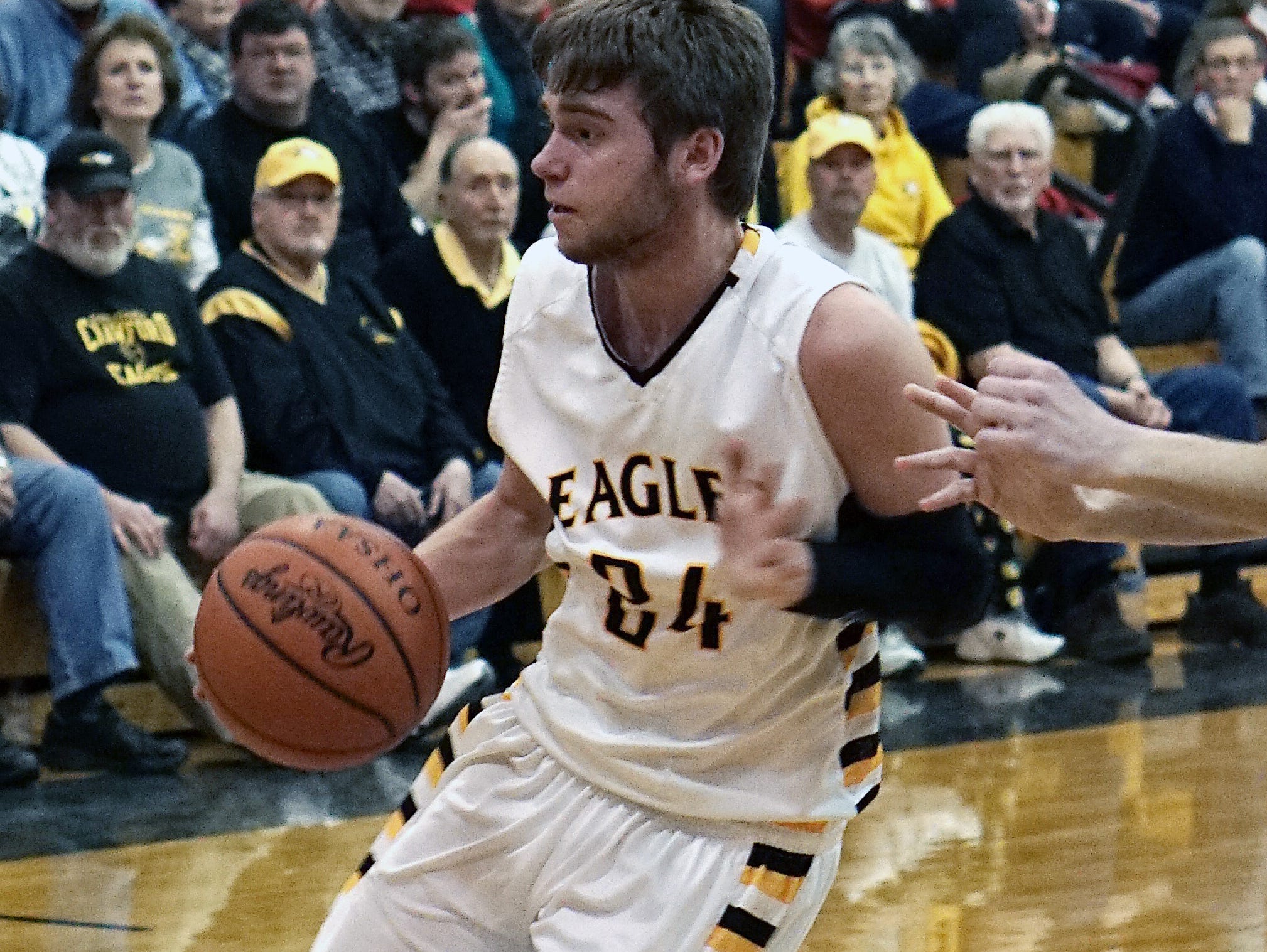 Colonel Crawford’s Todd Entenmann drives against Buckeye Central on Monday night. The Eagles clinched the Northern 10 Athletic Conference title outright with the win.