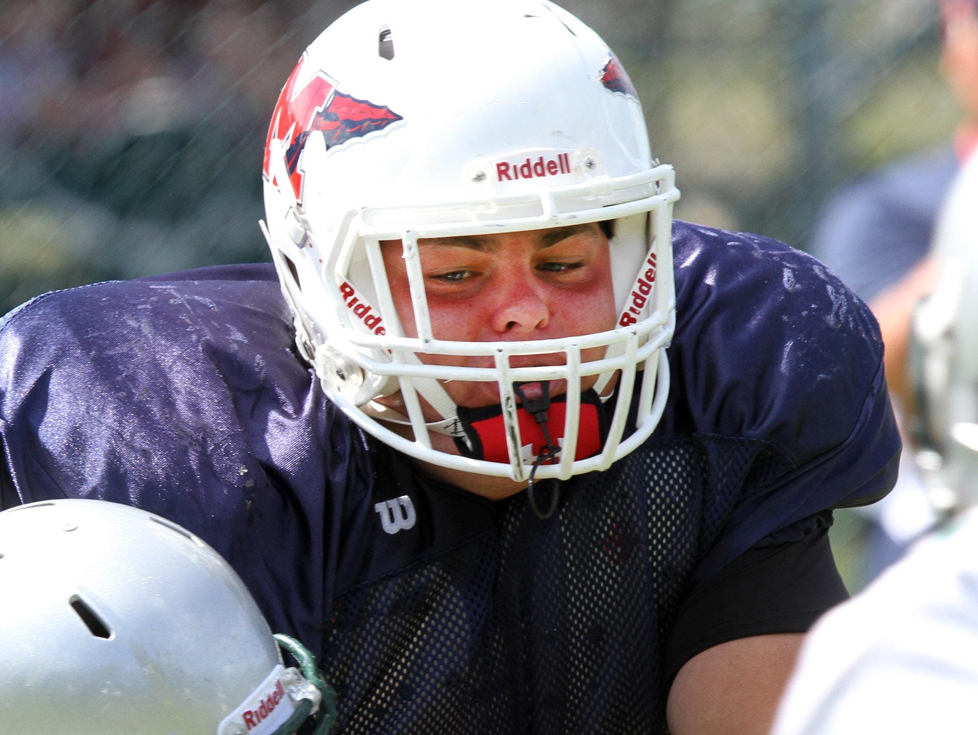 Manalapan offensive lineman Joe Sellmeyer blocks a Colts Neck player during a scrimmage Aug. 27.