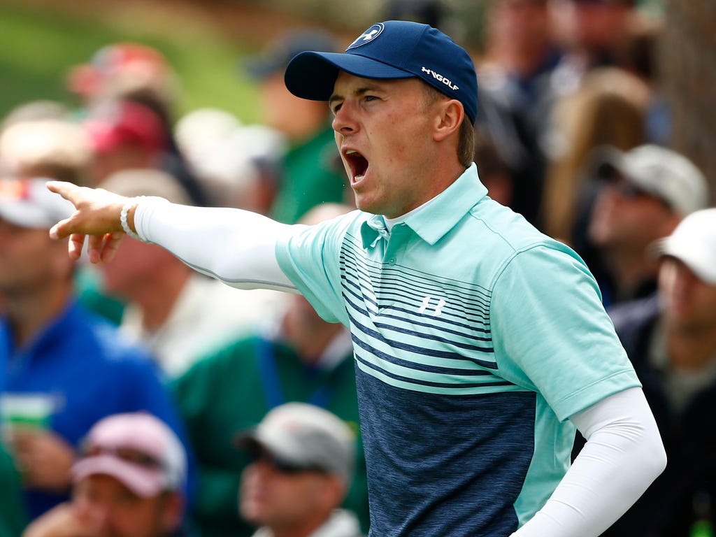 Jordan Spieth gestures to his tee shot on the 17th hole during the first round of The Masters golf tournament at Augusta National Golf Club in Augusta, Ga.