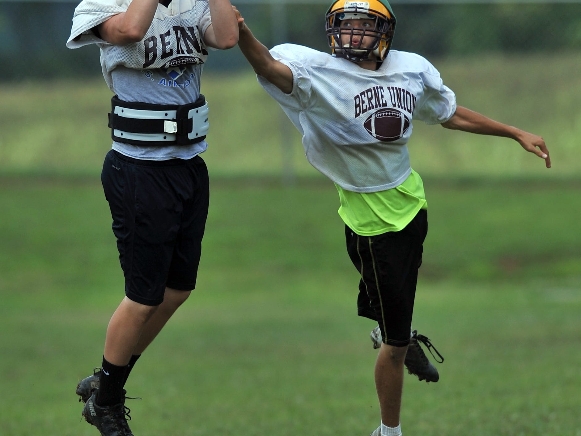  Hanson Holter, left, picks off a pass intended for Peter Redman Aug. 12 during a Berne Union High School football practice in Sugar Grove. 