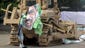An Egyptian military bulldozer smashes a protest camp at Al-Nahda Square.