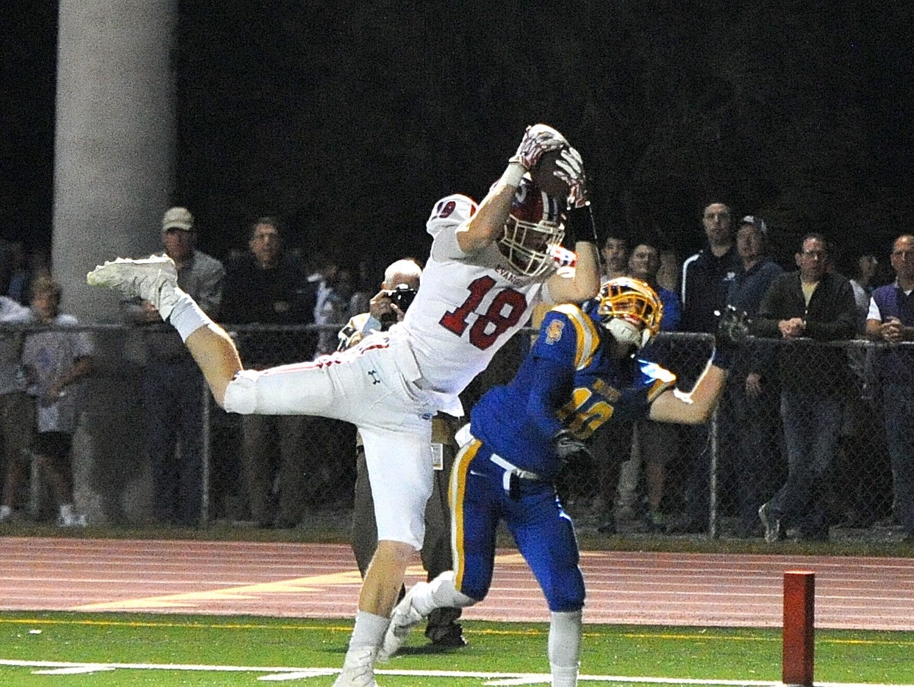 Evangel's Christian Bailiff goes up for a catch in a game earlier this seson.
