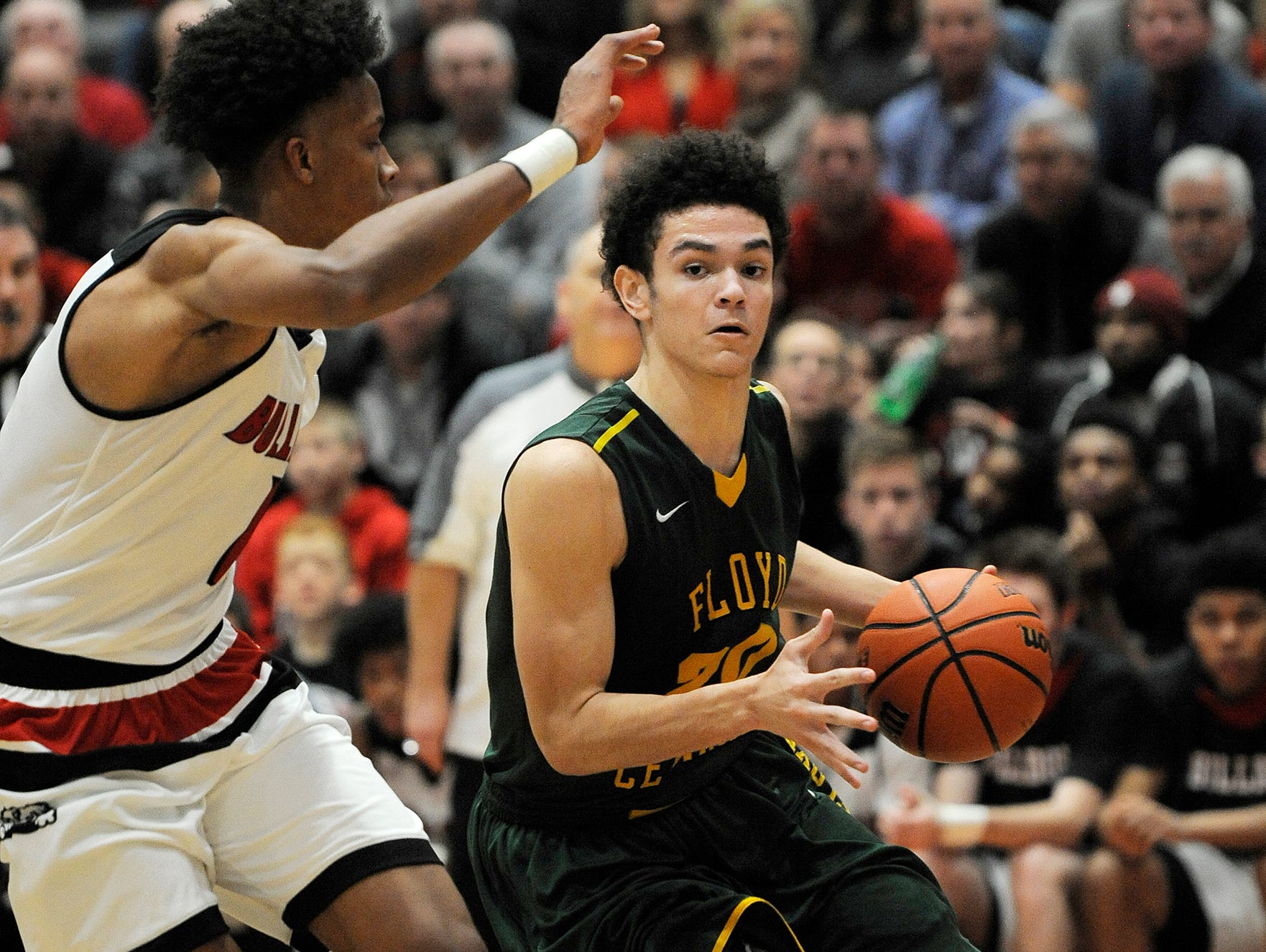 Floyd Central's Cobie Barnes (right) drives against New Albany's Romeo Langford (left) on Friday at New Albany High School. (Photo by David Lee Hartlage, Special to The Courier-Journal) Dec. 9, 2016