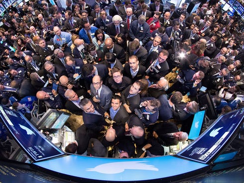 The New York Stock Exchange trading floor is crowded with traders and journalists on the morning of Twitter's public stock debut on Nov. 7.