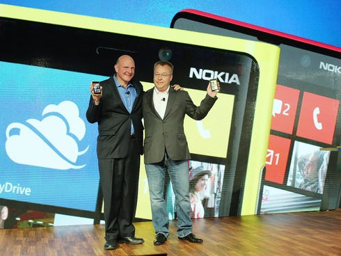 FILE - SEPTEMBER 3, 2013: It was reported that Microsoft has reached a deal with Nokia to buy the handset and services business of Nokia for more than $7.1 billion Then Nokia Chief Executive Stephen Elop with Microsoft CEO Steve Ballmer launching a n
