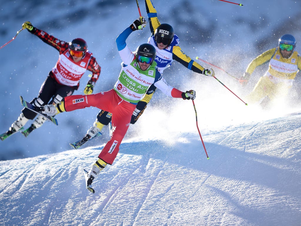 Skiers race during the men's and women's ski cross at the FIS Freestyle Ski World Cup in Val-Thorens, France.