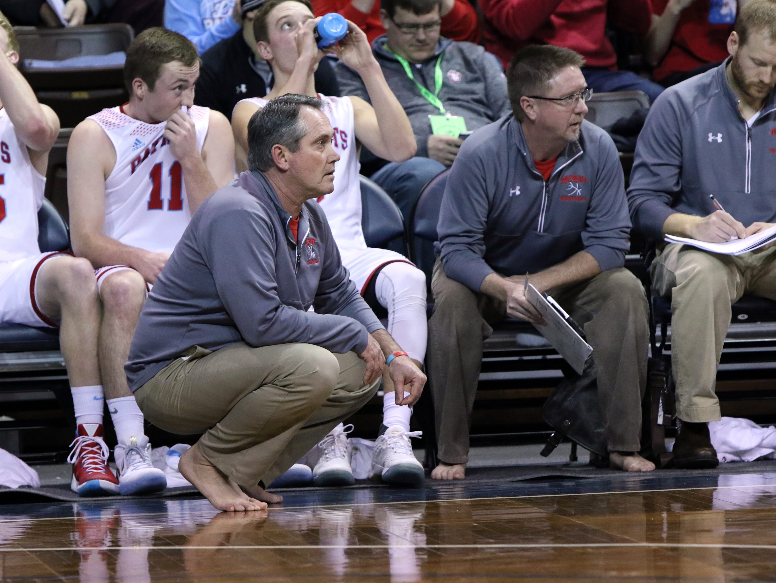 SF Lincoln Head Coach, Jeff Halseth goes shoeless during Saturday's game at the Samaritan's Feet Barefoot Classic at the Pentagon