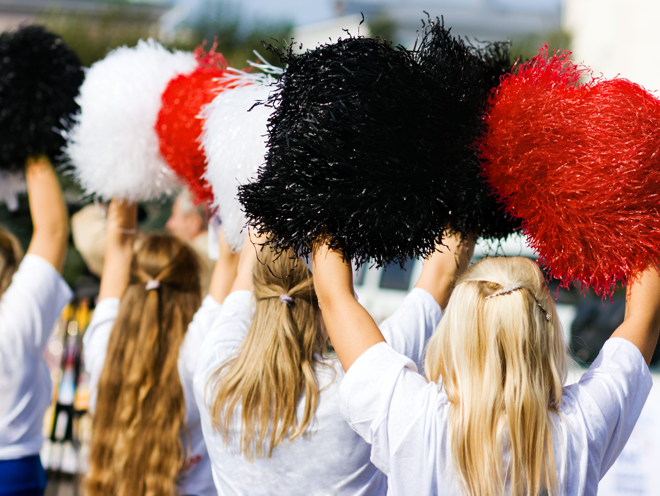 Cheerleaders with pom poms