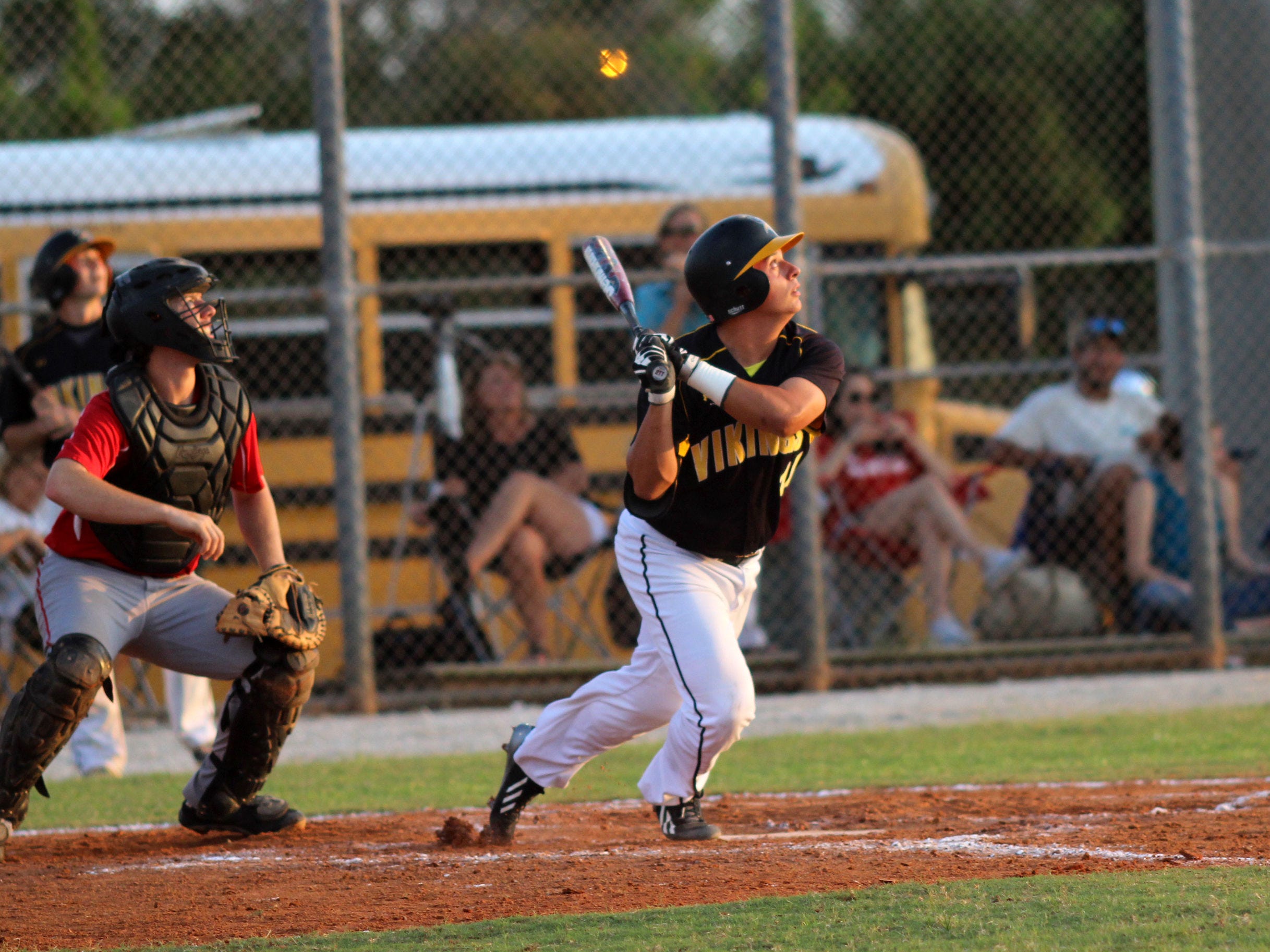 Anthony Tejeda looks up at his hit during Friday's district final game against LaBelle.
