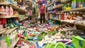Nina Quidit cleans up the Dollar Plus and Party Supplies Store in American Canyon, Calif., after a magnitude-6.0 earthquake struck the region before dawn on Aug 24.