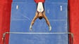 Sam Mikulak competes on the horizontal bar during the