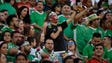 Mexican team fans cheer as the soccer game begins against