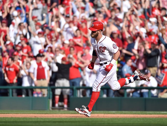 Harper rounds the bases after hitting a home run on
