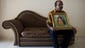 Subramaniam Gurusamy, the father of Puspanathan Gurusamy who was traveling to Beijing aboard the missing Malaysia Airlines Boeing 777-200 aircraft, holds a wedding portrait of his son at his house in Teluk Panglima Garang, Malaysia.