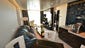 The most luxurious of the 2,014 cabins on Norwegian Getaway are the 42 suites found inside The Haven, a private enclave at the top of the ship. Here, the living area of an Owner's Suite.