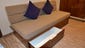 More storage is available in large drawers under the sofas in Balcony Staterooms.