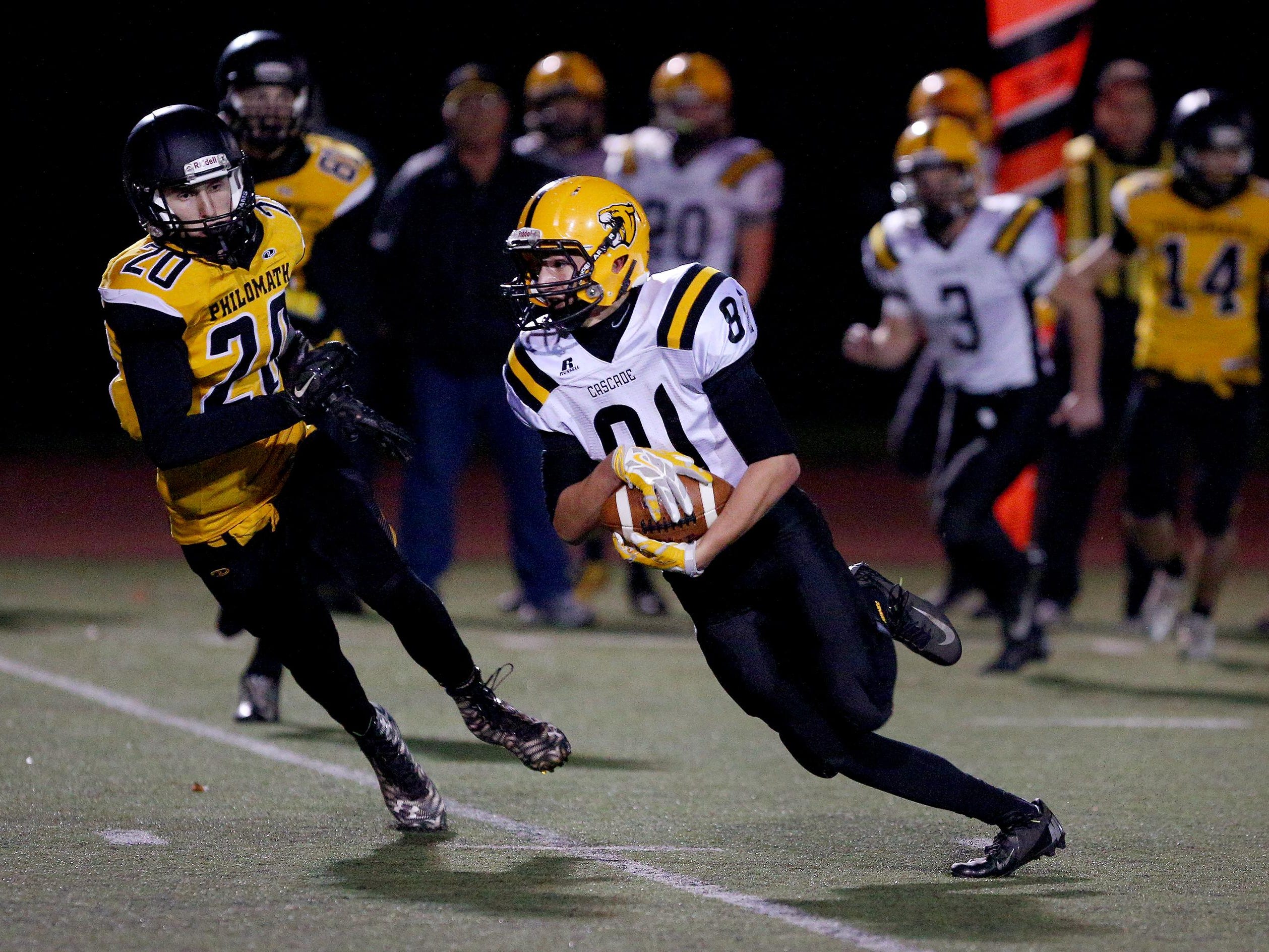 Cascade wide receiver Michael Biddington (81) runs after a catch against Philomath during the quarterfinals of the OSAA Class 4A state playoffs, Friday, November 13, 2015, at Corvallis High School in Corvallis, Ore. Cascade won the game 35-34.