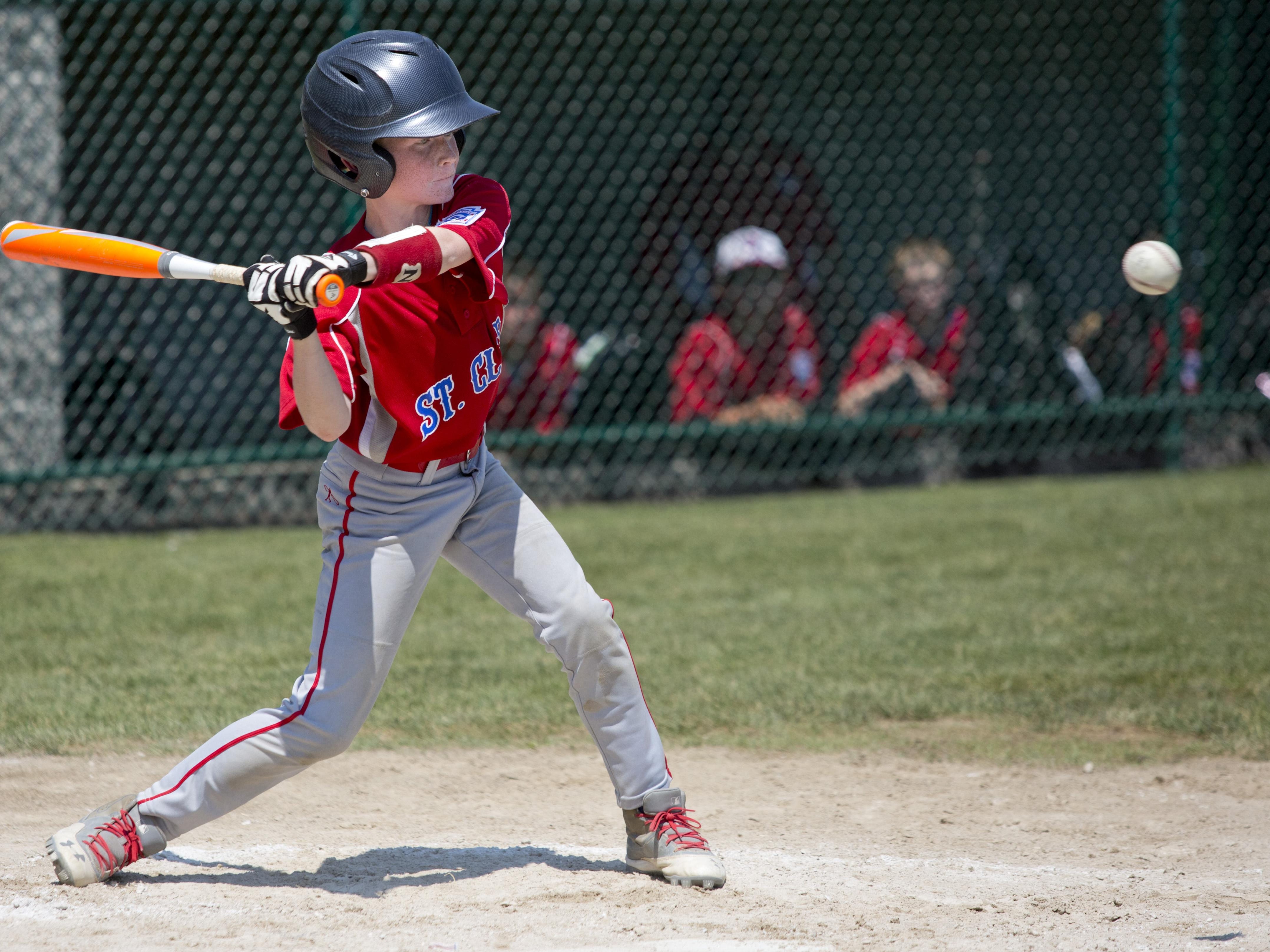 Carter Boullard gets a hit during a 10-and-under state semifinal baseball game Tuesday, July 28, 2015 in St. Clair.