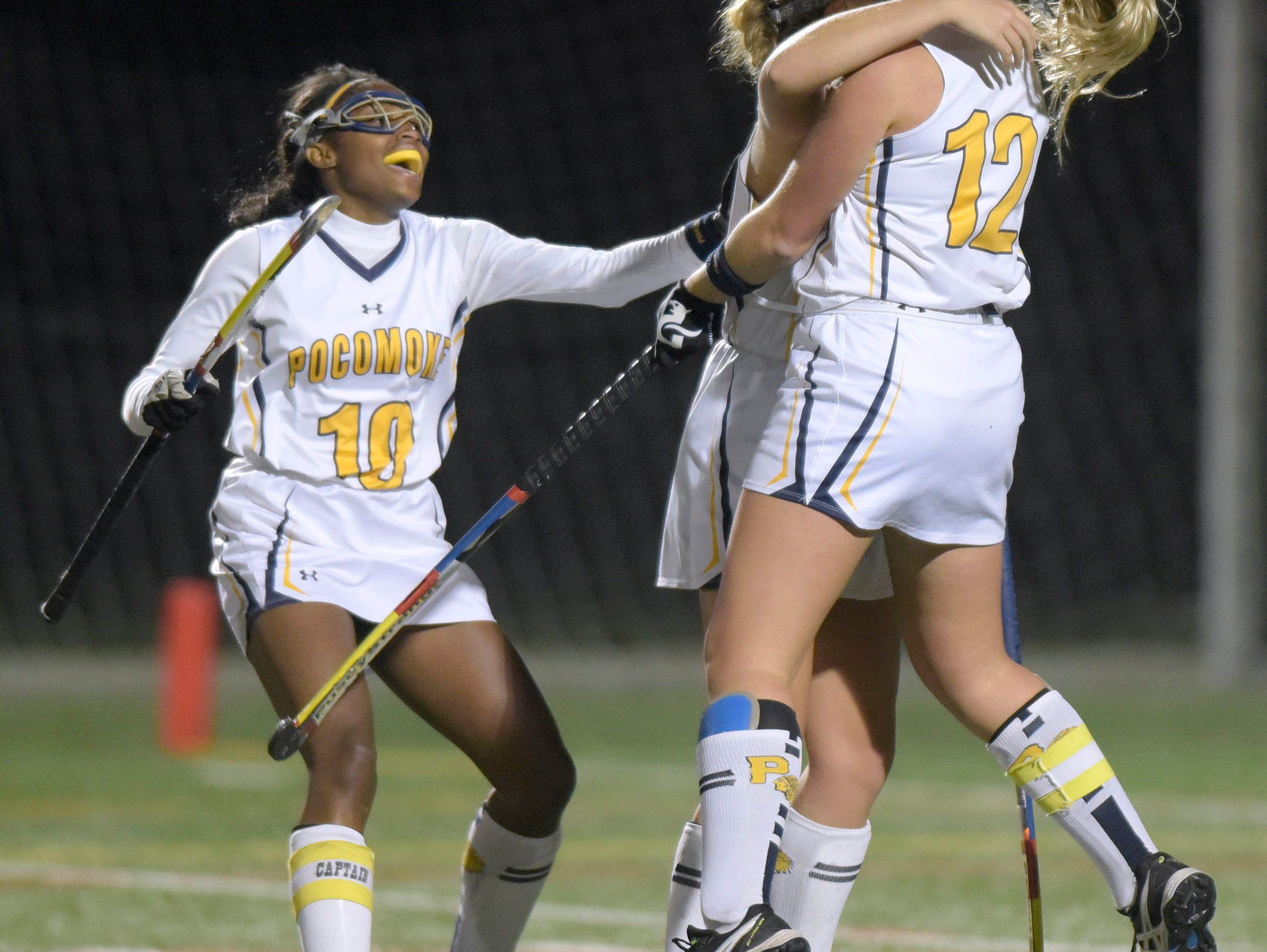 From left, Pocomoke's Shayla Jones, Kasey Lee and Lexi Butler celebrate Lee's goal against Manchester Valley in the second half of a Class 1A state semifinal field hockey game, Wednesday, Nov. 11, 2015 in Burtonsville. (Photo by Steve Ruark)