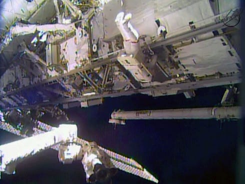 In this image made from video provided by NASA, astronaut Rick Mastracchio performs a space walk outside the International Space Station on Saturday.