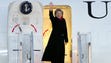 Secretary of State Hillary Clinton waves upon leaving