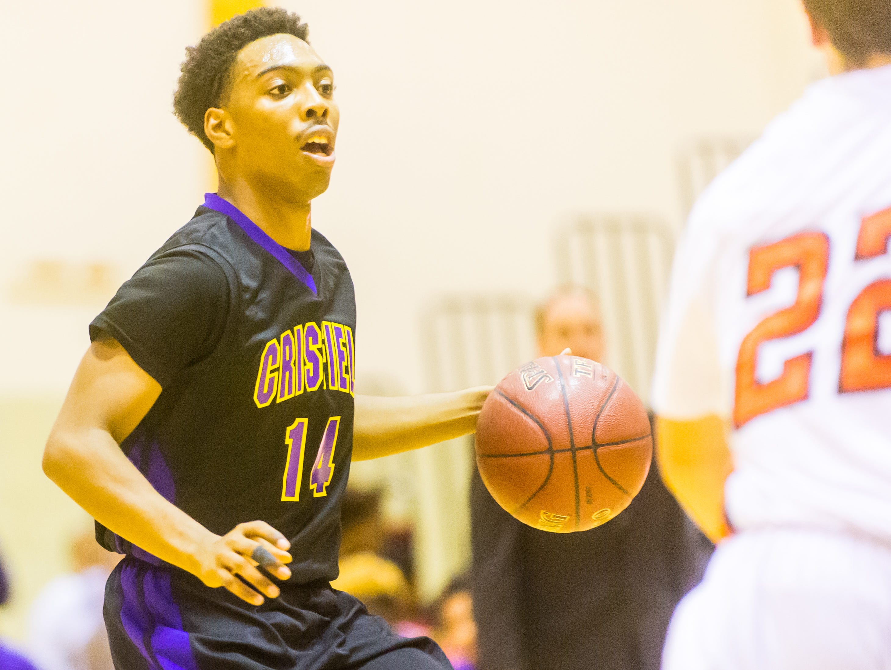 Crisfield guard DeQuantae White (14) looks to pass against Easton on Friday, December 4th at Easton High.