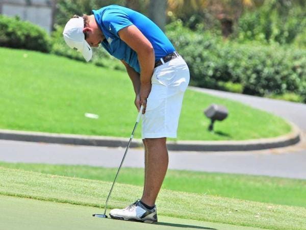 Former Florida High golfer Henry Westmoreland tries to hide his emotions after a missed putt on the 18th hole during Sunday’s finale of the Ogelthorpe Invitational.