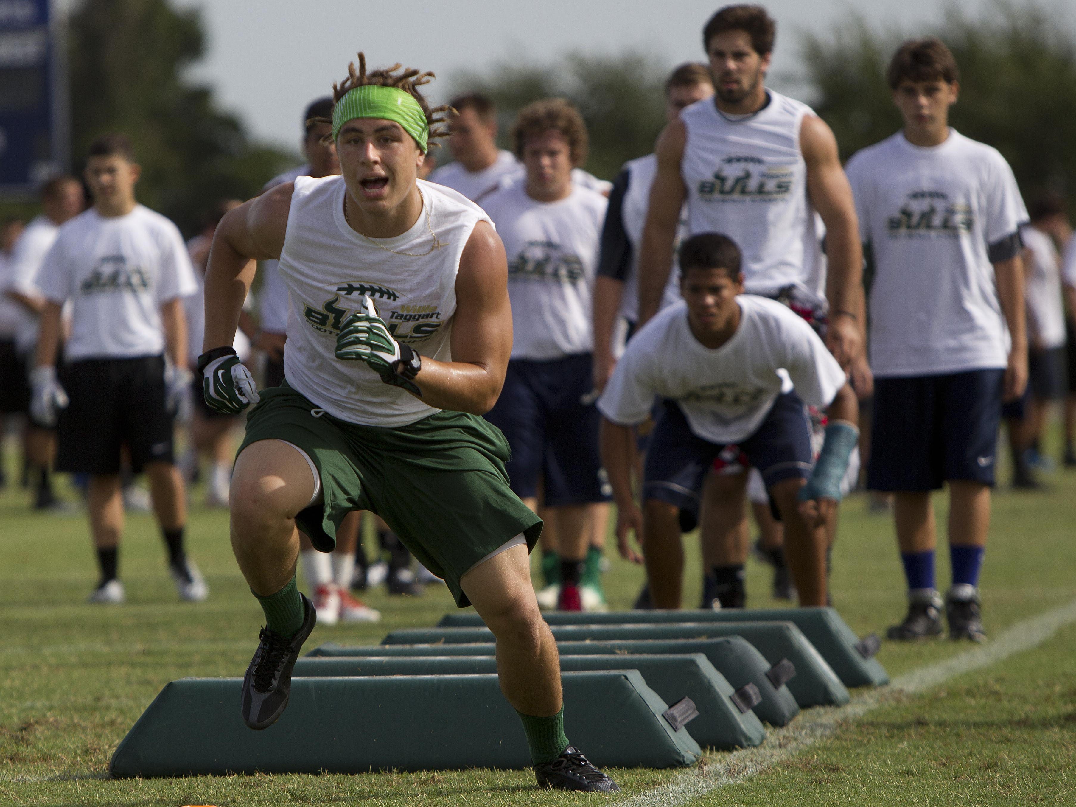 Players run through drills last year at the USF football camp at Estero High School. On Thursday, the camp moves to North Fort Myers, where the Bullls will hold their third straight camp in Southwest Florida.