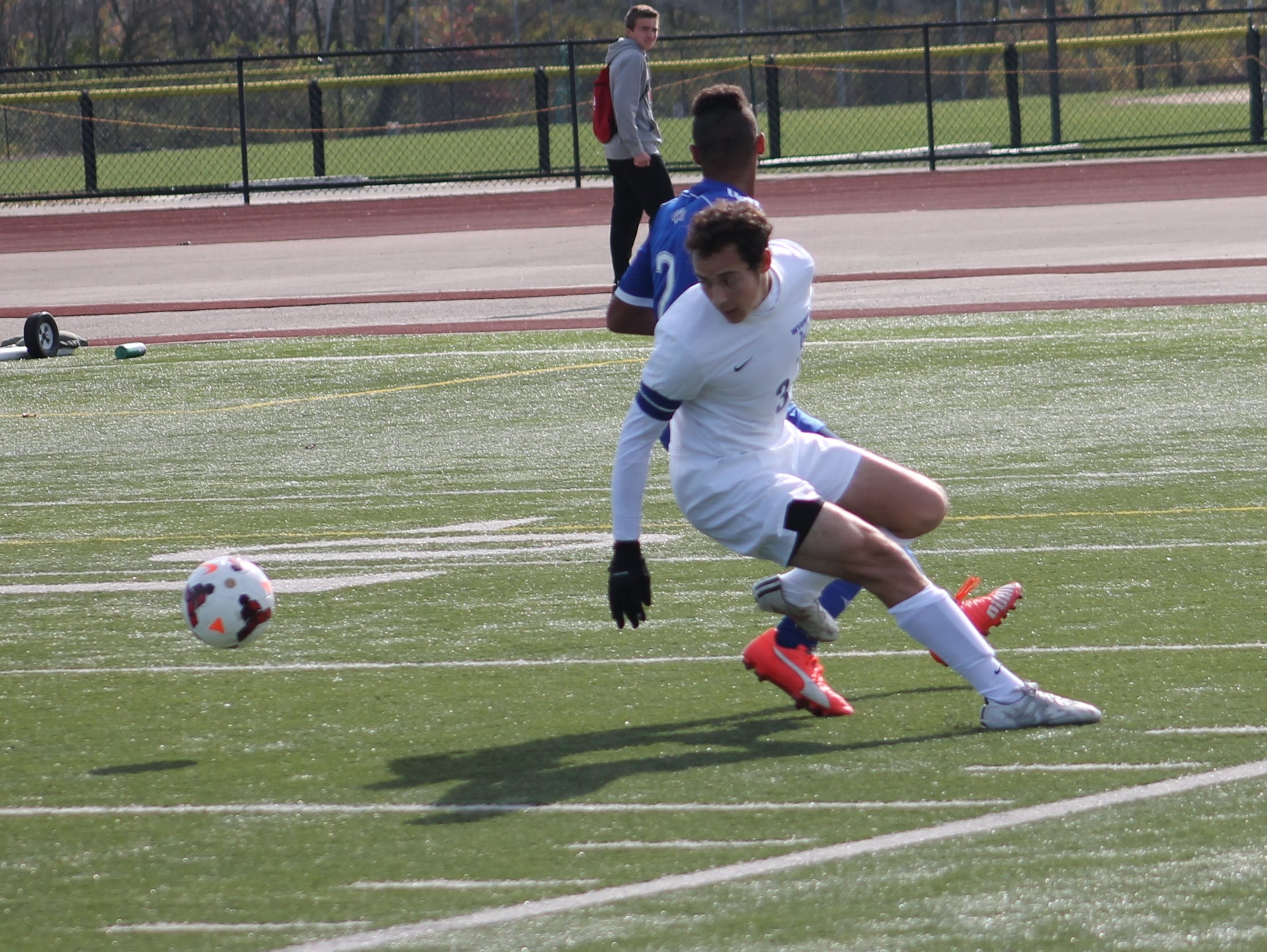 Wyoming senior captain Jay Klein tries to reverse field against Carroll junior Mekhi Jones Nov. 7.