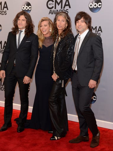 Members of the Band Perry let  Steven Tyler squeeze
