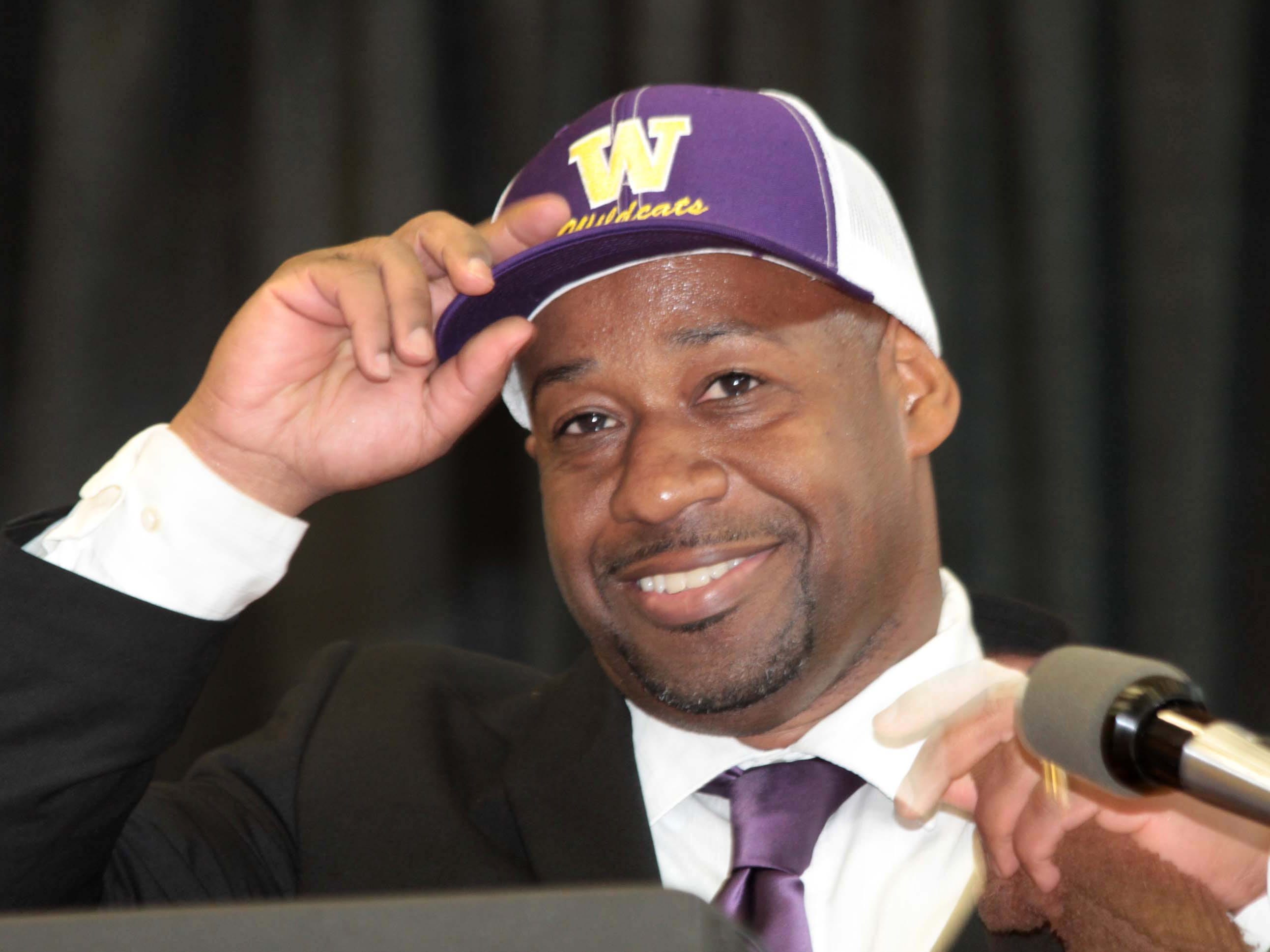 Former Ouachita head coach Casey Jones puts on the Wossman cap as he returns to his alma mater as head basketball coach. Wossman introduced Jones Tuesday afternoon.