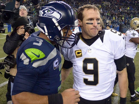 Seattle Seahawks quarterback Russell Wilson (3) and New Orleans Saints quarterback Drew Brees (9) shake hands after the game at CenturyLink Field.